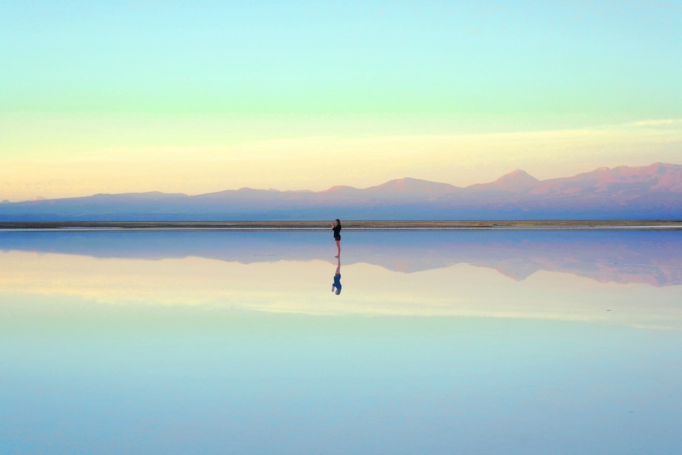Person standing by water, representing quarterly reflection and intentional planning for neurodivergent professionals